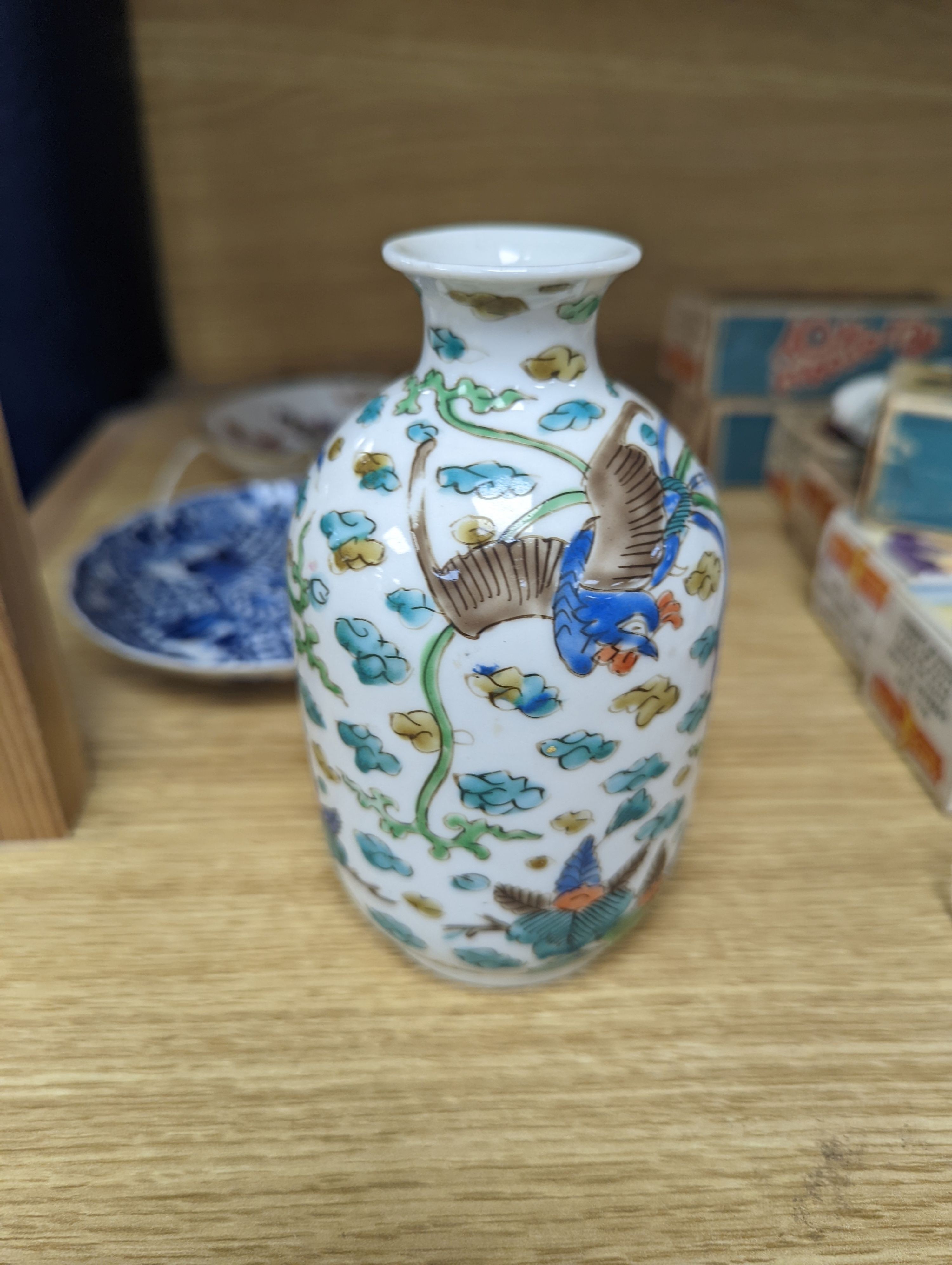 Two Chinese porcelain saucer dishes and an enamelled porcelain vase, 18th century and later, 12.5cm